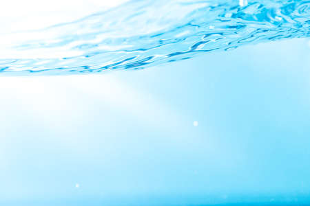 Water wave with bubble of air, on white background. Blue waterの写真素材