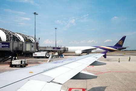 Bangkok, Thailand - May 19, 2016 : Airplanes from Thai Airways (TG) are parked at their hub at the Suvarnabhumi Airport (BKK) in Bangkok.のeditorial素材