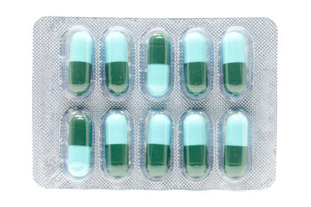 blue green antibiotic pills gelatin capsule in blister pack