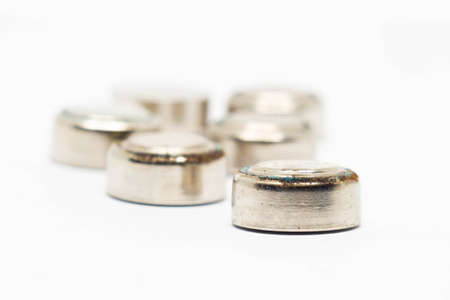 small watch rusty batteries isolated on white backgroundの写真素材