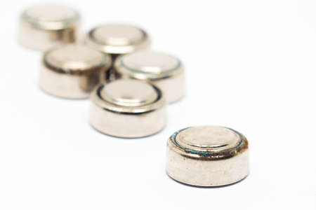 small watch rusty batteries isolated on white backgroundの写真素材