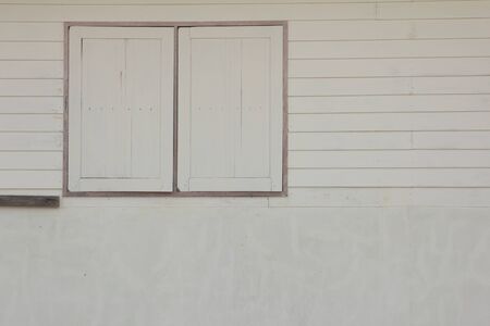 White wood wall with windowの写真素材
