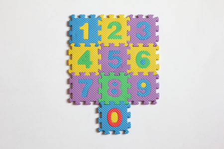 Number puzzle piece placed on white background