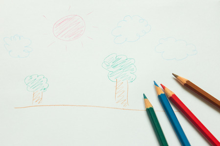Child painting by color pencilの写真素材