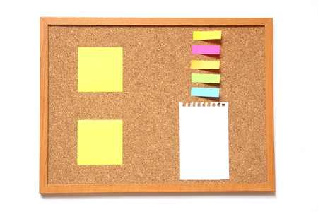 Corkboard with paper placed on white backgroundの写真素材