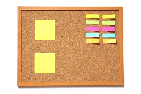 Corkboard with paper placed on white backgroundの写真素材