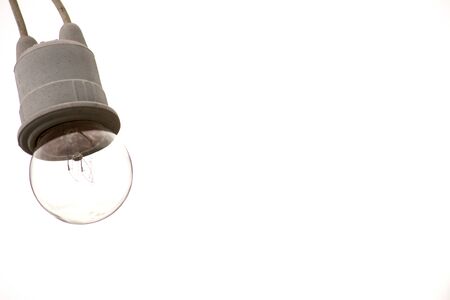 Hanging light bulb on white backgroundの写真素材