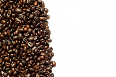Roasted brown coffee bean as frame on white backgroundの写真素材