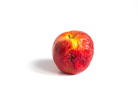 Wizen apple presented as old aging skinの写真素材