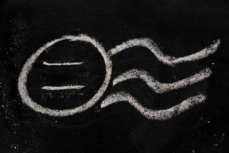 Chalk drawing as blank stamp postmark on blackboard backgroundの写真素材
