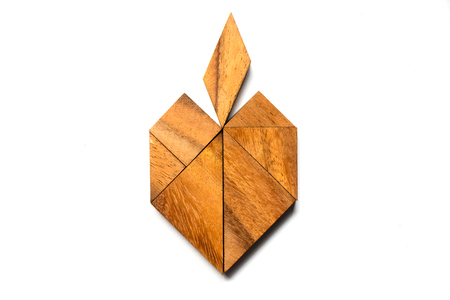 Wooden tangram puzzle in apple shape on white backgroundの写真素材