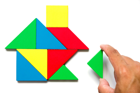 Colorful tangram puzzle in home shape wait for fulfillment (Concept for complete or dream life)の写真素材