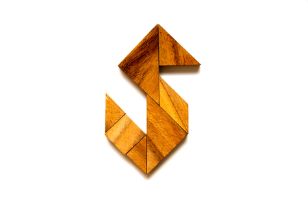 Wooden tangram puzzle as English alphabet letter "S" shape on white backgroundの写真素材