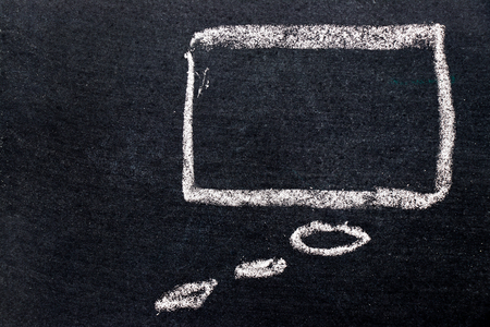 White chalk drawing as bubble speech on black board background (Concept as thinking)の写真素材