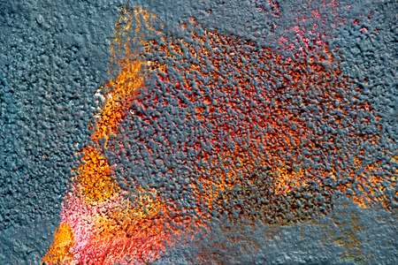 Abstract color painting on concrete block background (black,red,orange)の写真素材
