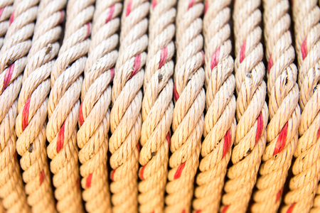 Coil arrangement of yellow brown rope background