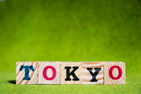 Letter block in word Tokyo on artificial green backgroundの写真素材