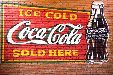 Bangkok, Thailand, December 2, 2017, A vintage advertisement for Coca-Cola on a brick wall. Coca-Cola is a popular carbonated soft drink.のeditorial素材
