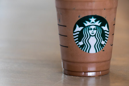 Ayutthaya, Thailand - DECEMBER 26, 2017 - Starbucks cold chocolate drink with whip cream in plastic cup. This is the largest coffee chain store.のeditorial素材