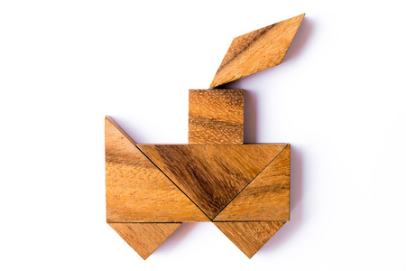 Wood tangram puzzle in train shape on white backgroundの写真素材