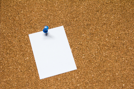 Blank white paper pin on cork board background for remind, to do list or news bulletinの写真素材