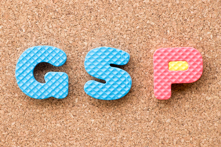 Color toy foam alphabet in word GSP (Abbreviation of Good Storage Practice or Generalized System of Preferences or Gross State Product) on cork board backgroundの写真素材