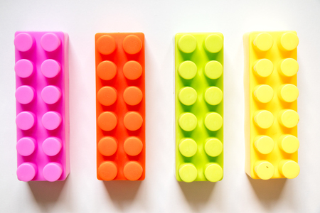 Multi color square plastic toy block on white backgroundの写真素材