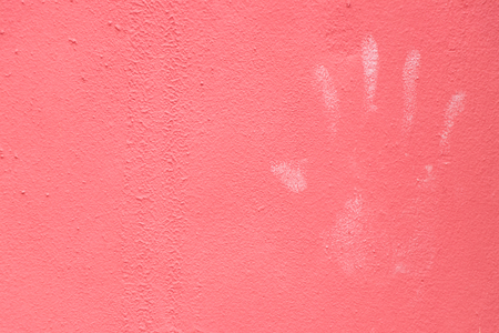 White handprint on pink color wall textured background (Concept for security, authorizatio)の写真素材