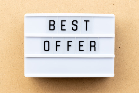Light box with word best offer on wood backgroundの写真素材