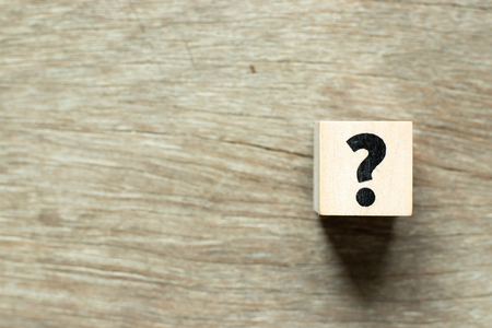 Letter block in question mark on wood backgroundの写真素材