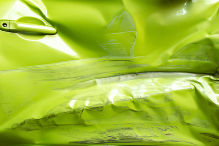 Closed up background  of damaged green color door of car that caused from accidentの写真素材