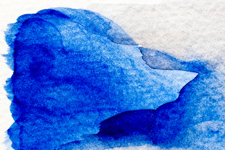 Blue color watercolor handdrawing as brush or banner on white paper backgroundの写真素材