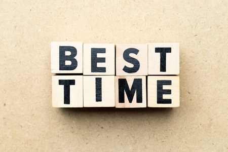 Alphabet letter block in word best time on wood backgroundの写真素材