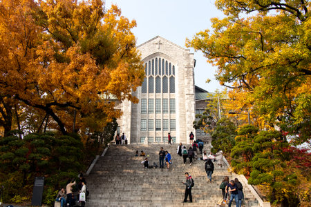 Seoul, South Korea, November 6, 2018, Student and traveler walk at Welch -Ryang Auditorium during autumn season, Ewha university that is the world's largest female educational instituteのeditorial素材