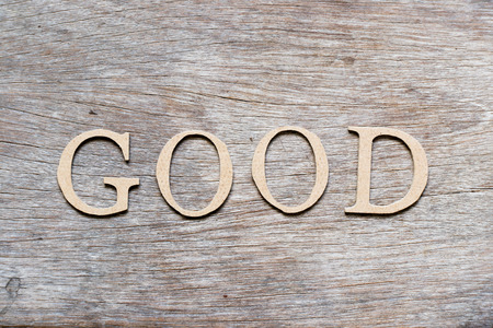Alphabet letter in word good on wood backgroundの写真素材
