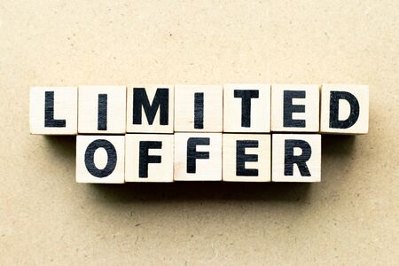 Letter block in word limited offer on wood backgroundの写真素材