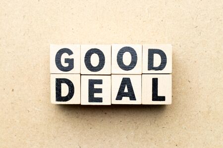 Alphabet letter block in word good deal on wood backgroundの写真素材