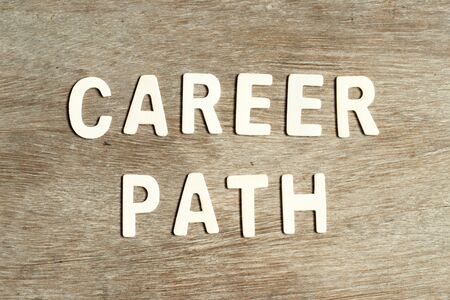 Alphabet letter in word career path on wood backgroundの写真素材