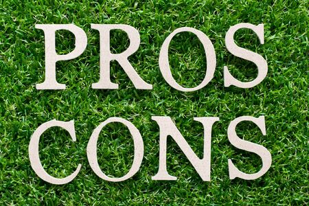 Wood alphabet in word pros cons on artificial green grass backgroundの写真素材