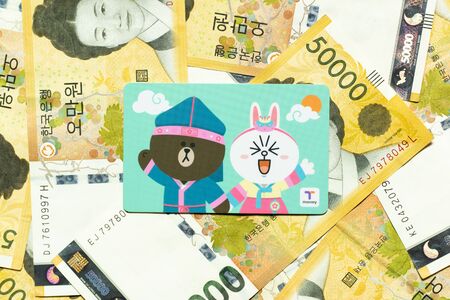 Bangkok, Thailand - Nov 15, 2019  : T money card with line cartoon character on Korean 50000 won banknote.のeditorial素材
