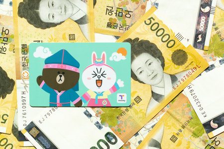 Bangkok, Thailand - Nov 15, 2019  : T money card with line cartoon character on Korean 50000 won banknote.のeditorial素材