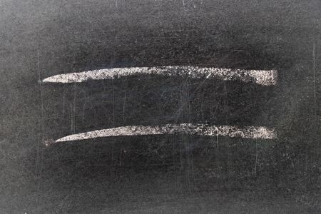 White chalk hand drawing in line shape on black board background