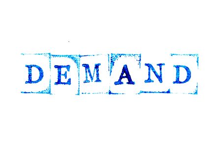 Blue ink of rubber stamp in word demand on white paper backgroundの写真素材