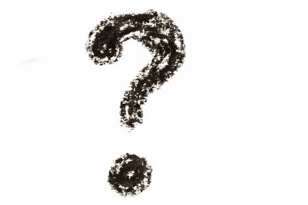 Black color oil pastel drawing in question mark shape on white paper backgroundの写真素材