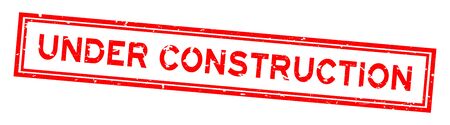Grunge red under construction word square rubber seal stamp on white backgroundのイラスト素材