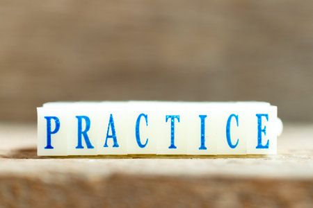 Letter block with blue color word practice on wood backgroundの写真素材