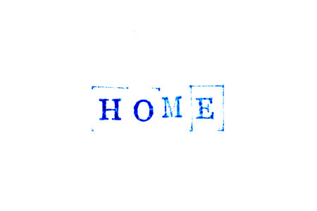 Blue color ink of rubber stamp in word home on white paper backgroundの写真素材