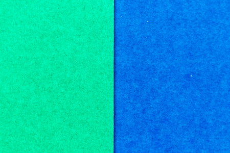 Abstract green and blue color paper textured background with copy space for design and decorationの写真素材