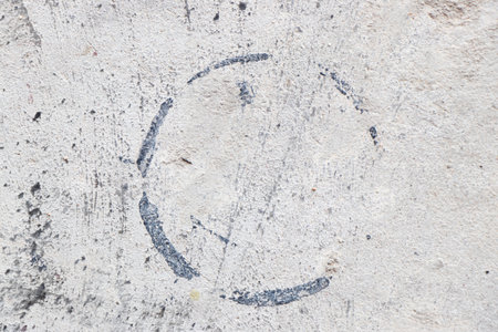Grunge gray color concrete wall textured background with black stain in circle shapeの写真素材