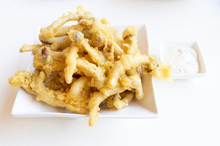 French fries that made by mushroom with dip sauce on white table background